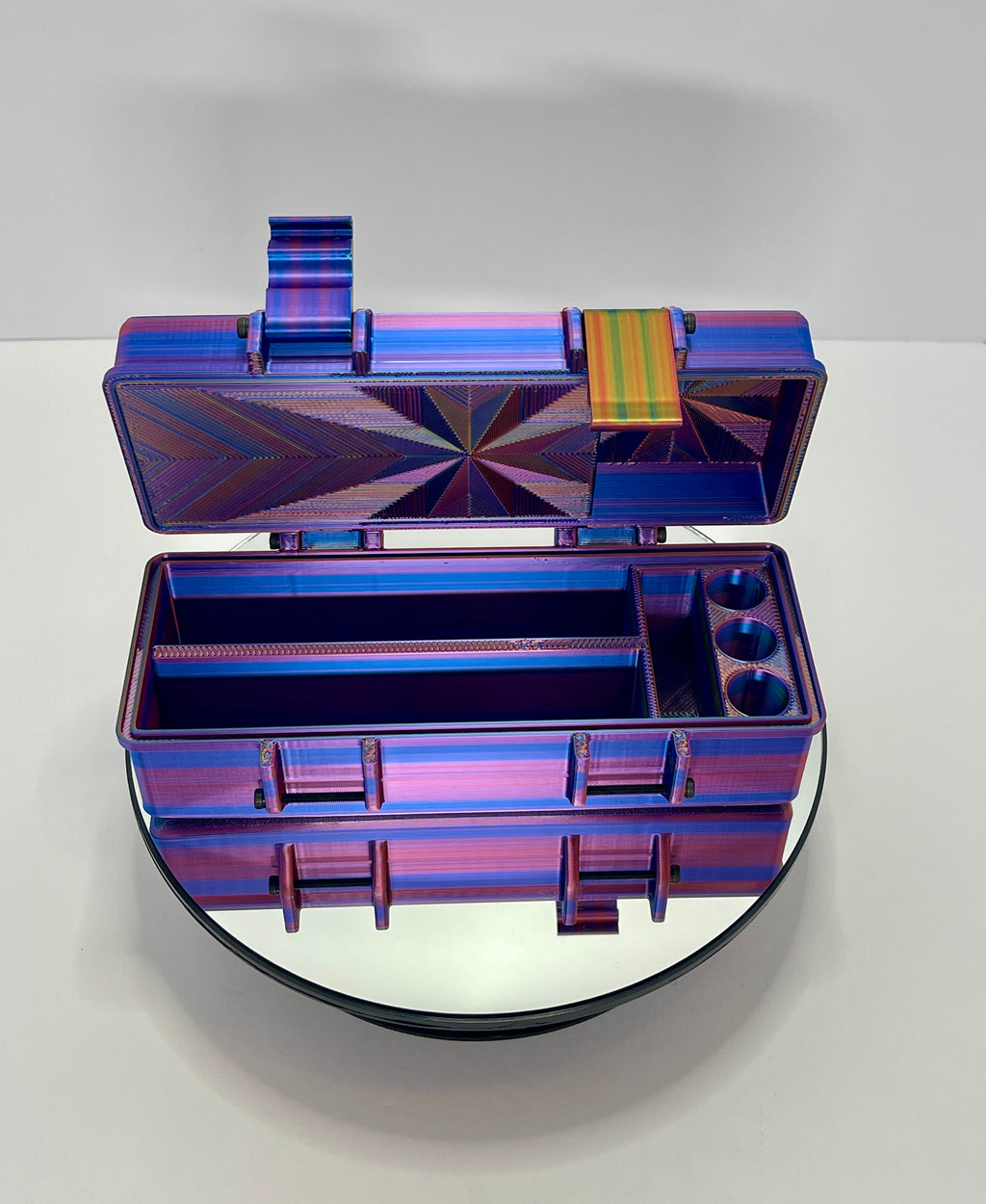 Open 3D-printed travel box showing divided interior and vial slots.